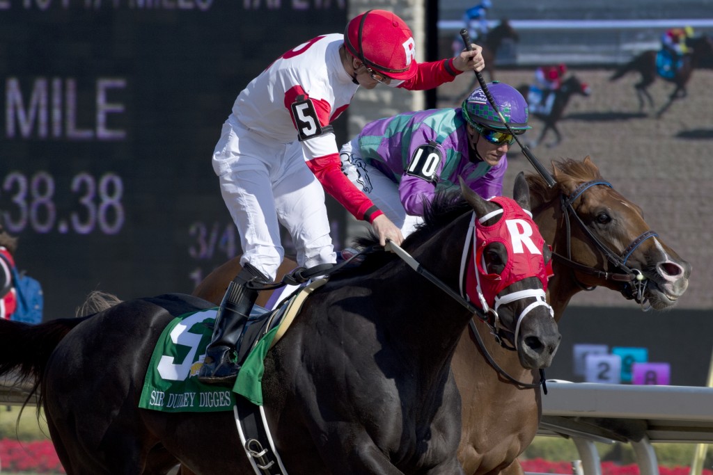 Julien Leparoux (red and white silks) guides Sir Dudley Digges to capture the 157th running of the $1,000,000 dollar Queen's Plate Stakes at Woodbine Racetrack.Sir Dudley Digges is owned by Kenneth and Sarah Ramsey and trained by Michael Maker. Michael Burns photo